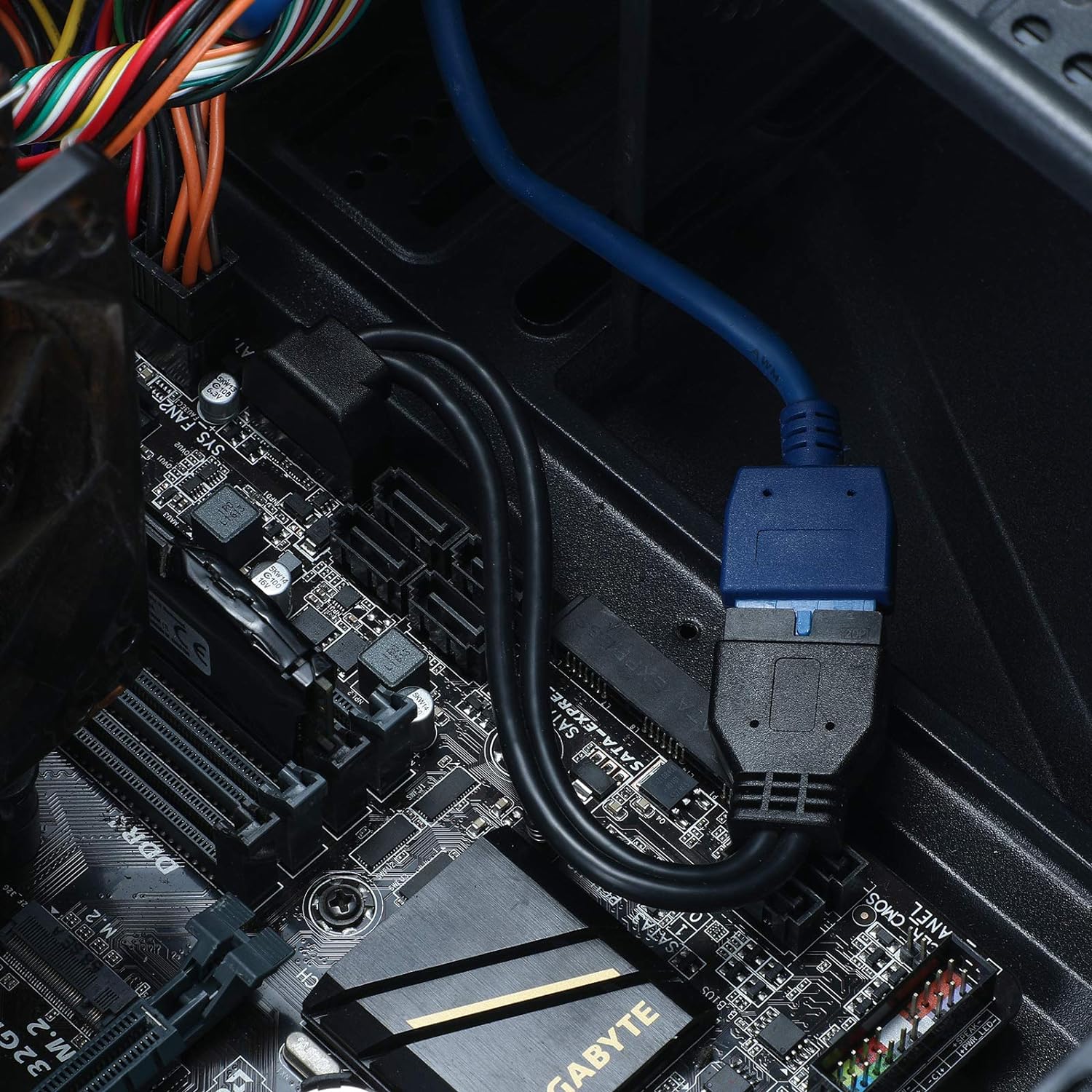 Internal USB 3.0 extension cable connected to motherboard inside gaming PC
