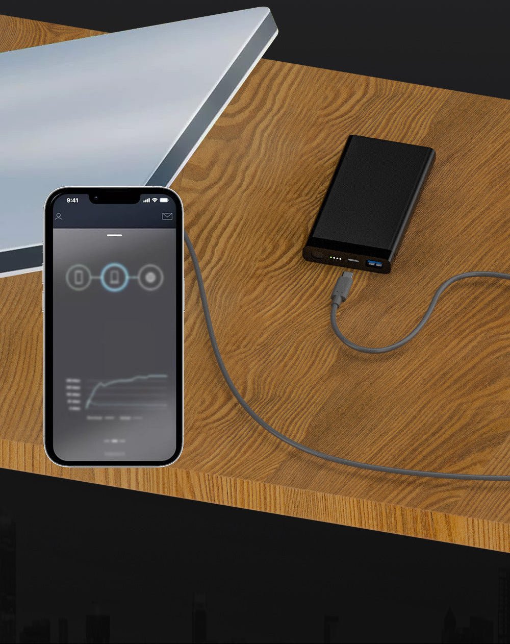 Smartphone charging from a power bank via USB-C cable on a wooden surface 