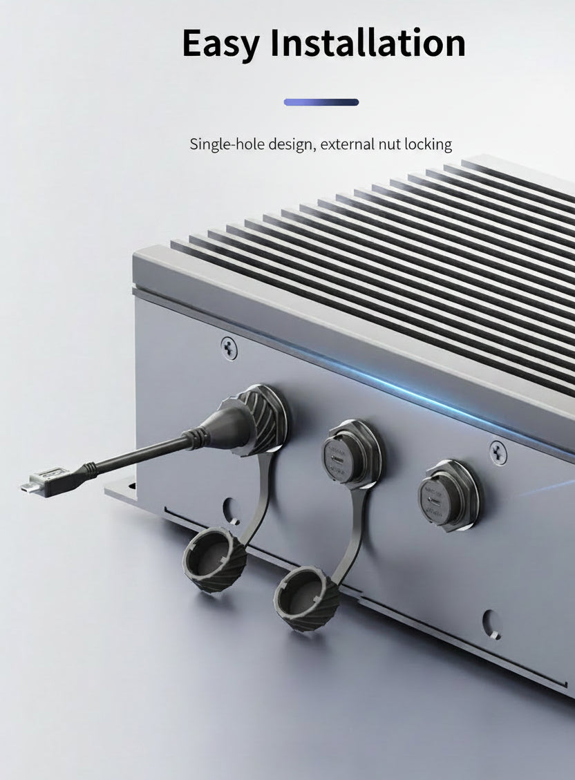Metal electronic device with cables and connectors on a light gray background