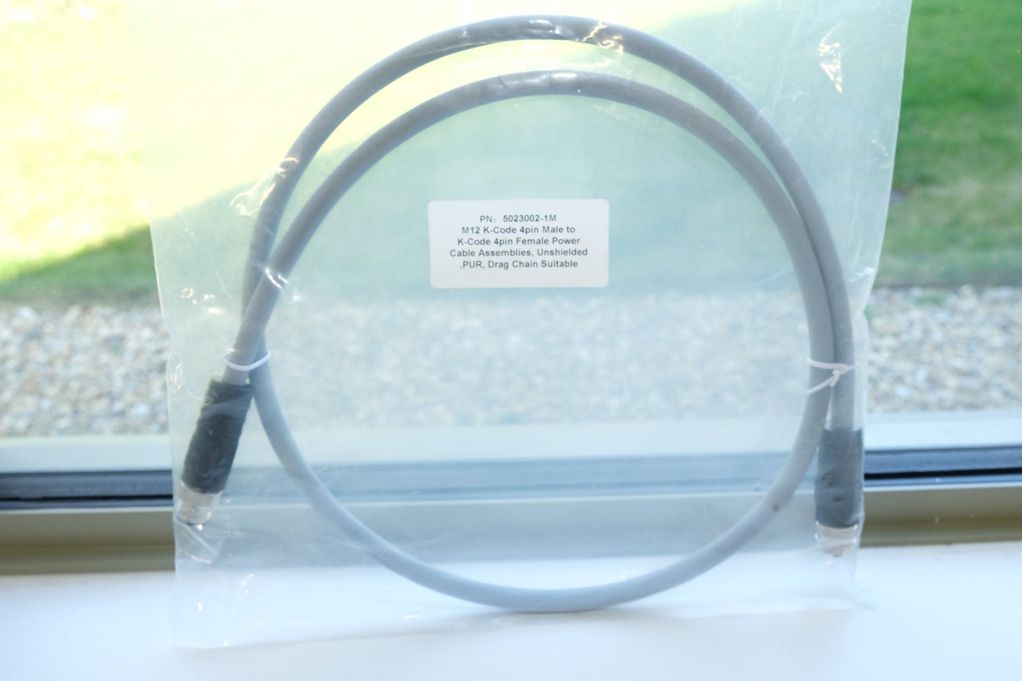 Close up of M12 K code connectors male and female