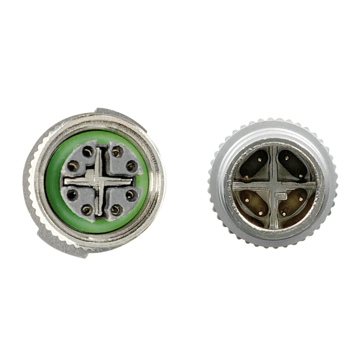 Two metallic objects with green and silver designs on a white background