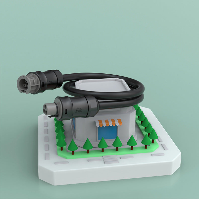 Model of a building with trees and two electrical plugs on a light green background