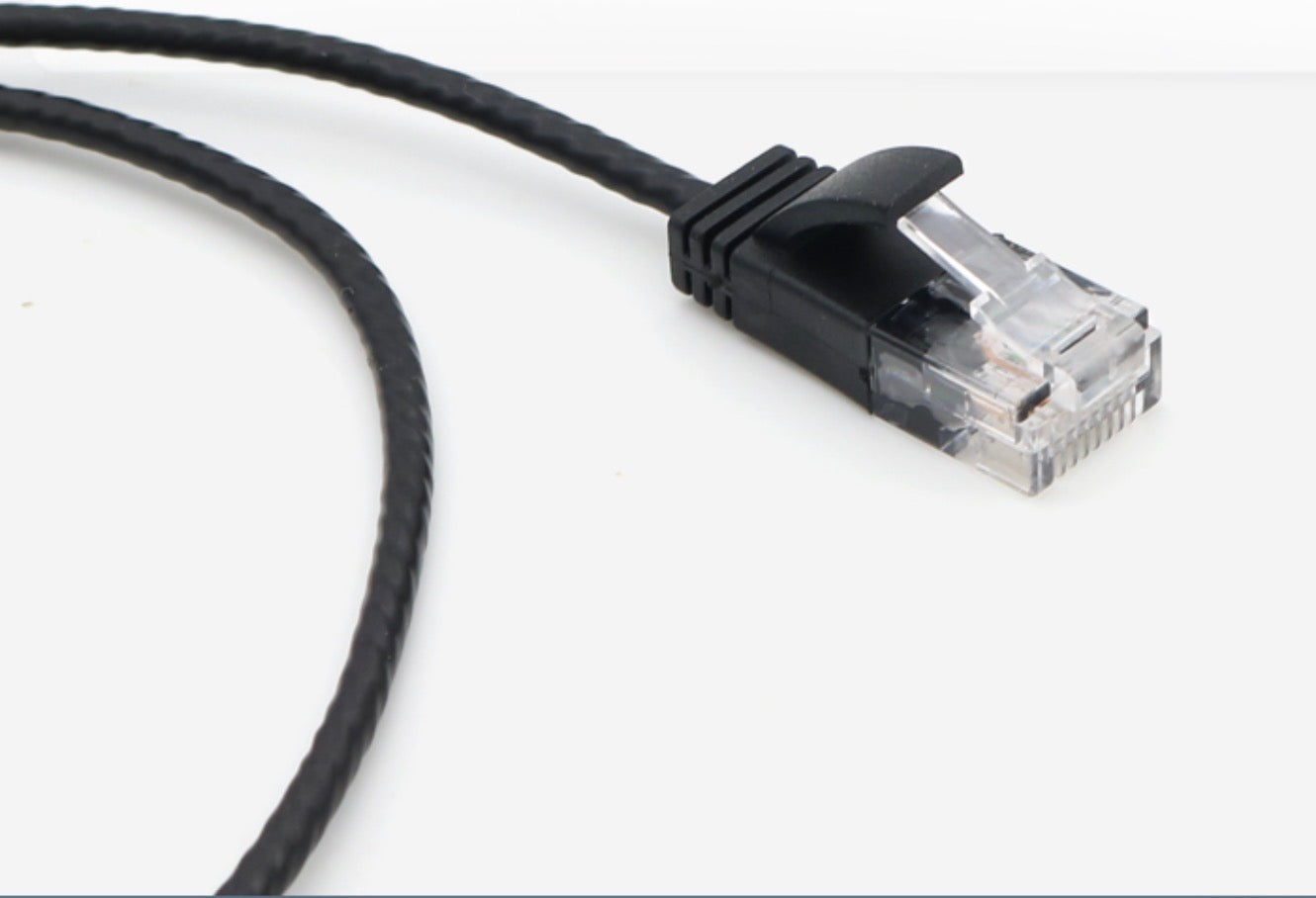 Close-up of the RJ45 connector on the Cat6 slim Ethernet cable