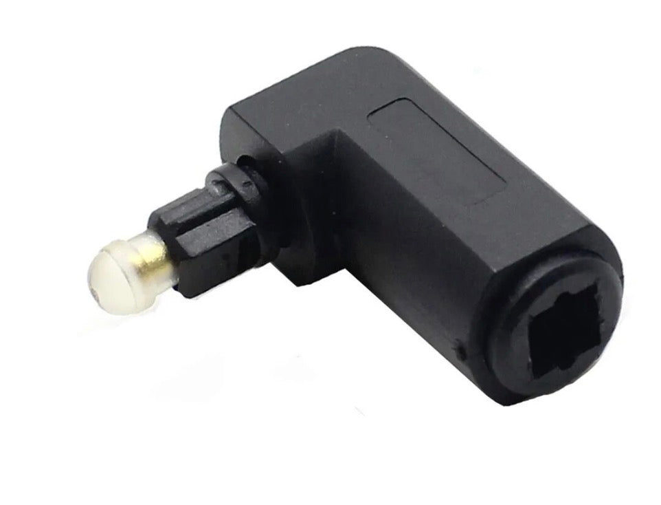 TOSLINK male to female adapter connected to optical audio equipment