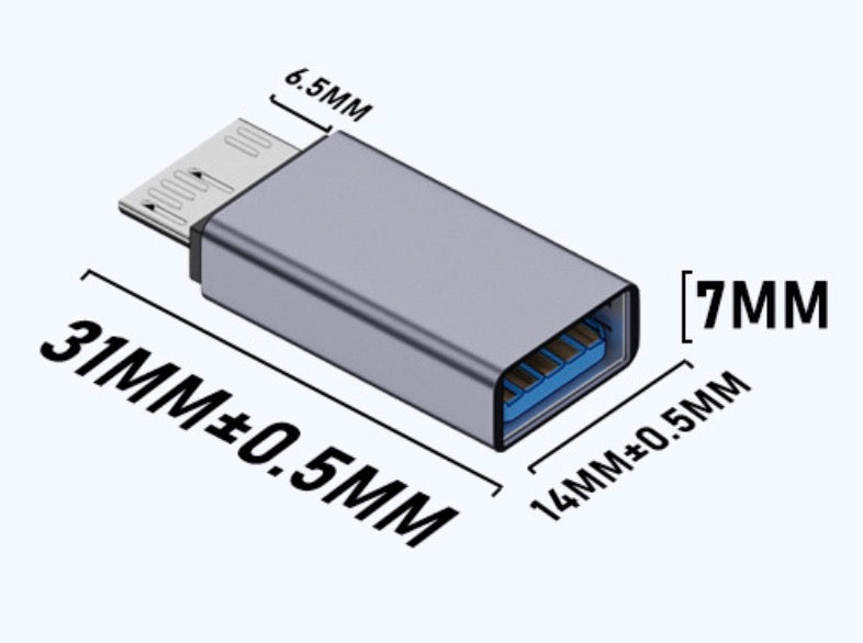 Micro USB B to USB 3.0 female adapter connected to desktop computer setup