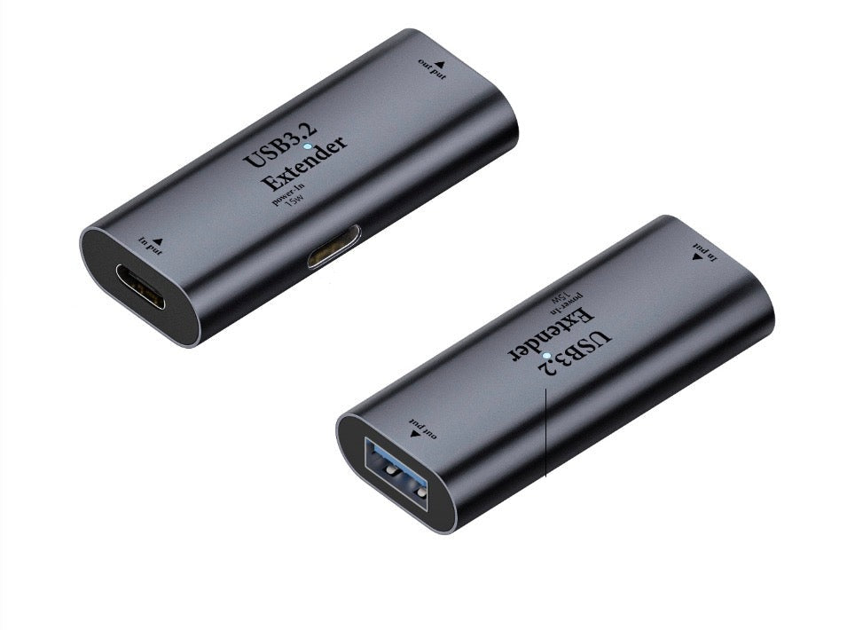 USB-A female to USB-C female active repeater adapter showing compact aluminium design