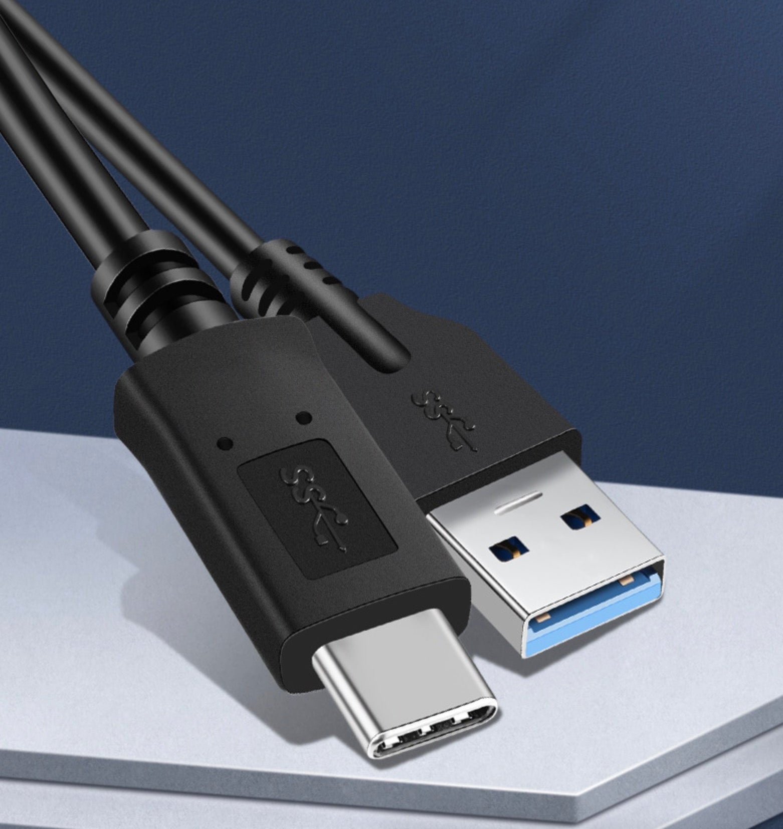 USB 3.0 Type-A to USB-C charging cable connected to a laptop for fast data synchronisation