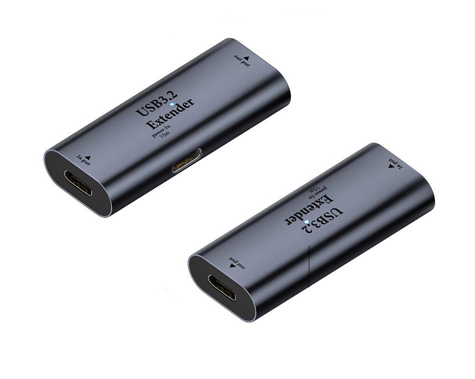 USB-C female to female repeater adapter showing compact aluminium housing
