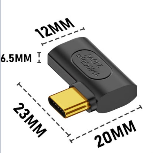 USB C angled adapter connected to laptop docking and display setup