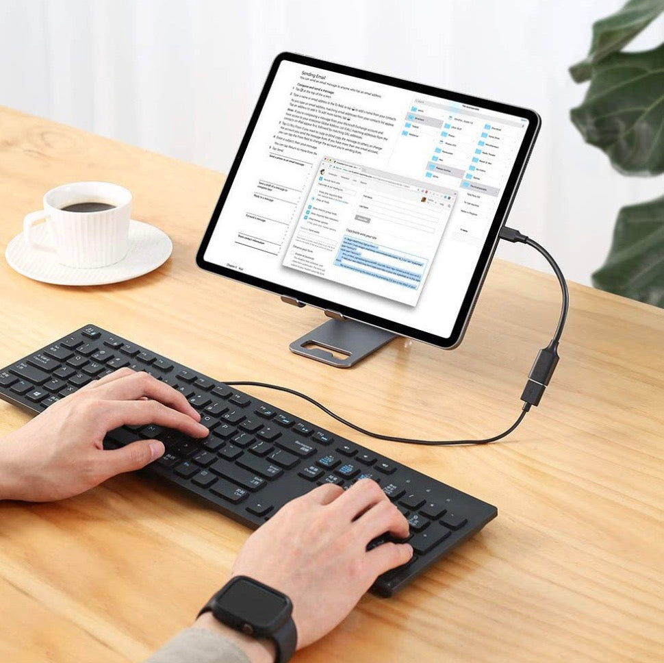 USB-C OTG extension cable connected to a laptop for USB keyboard and peripheral connectivity