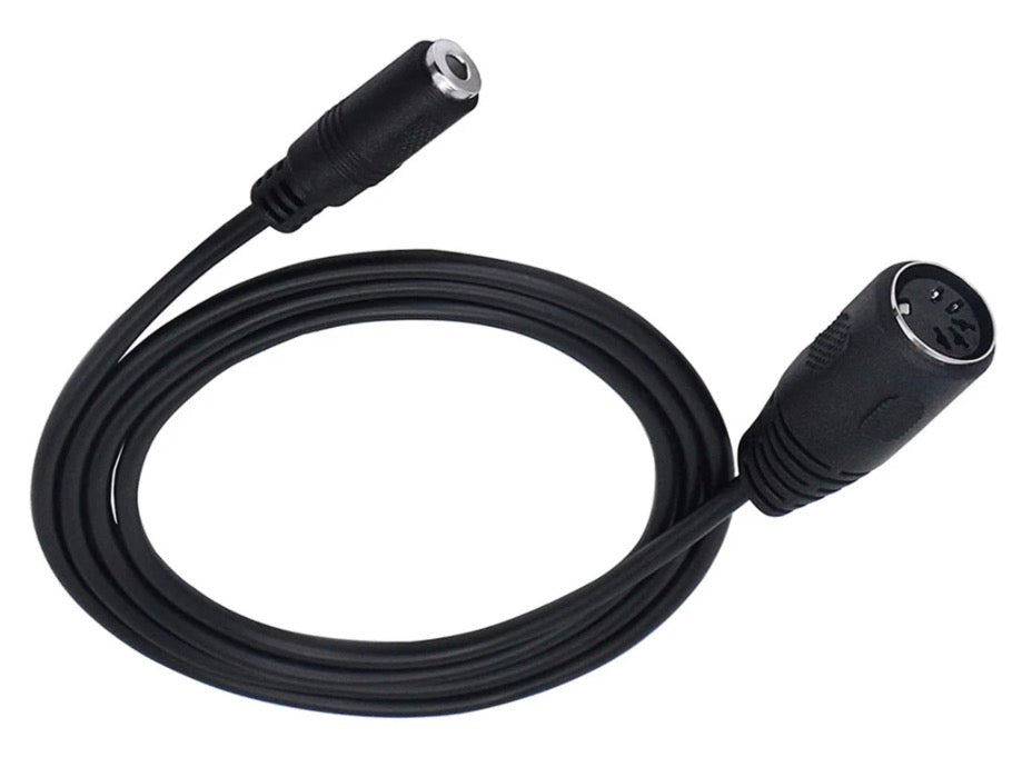 DIN to AUX adapter connected to vintage Hi-Fi system.