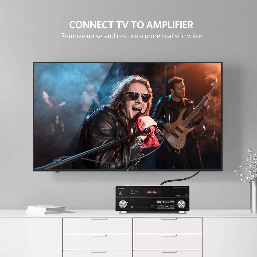 Dual RCA male to dual RCA male right-angle stereo audio cable connected between a Hi-Fi amplifier and audio source for high-quality analogue sound