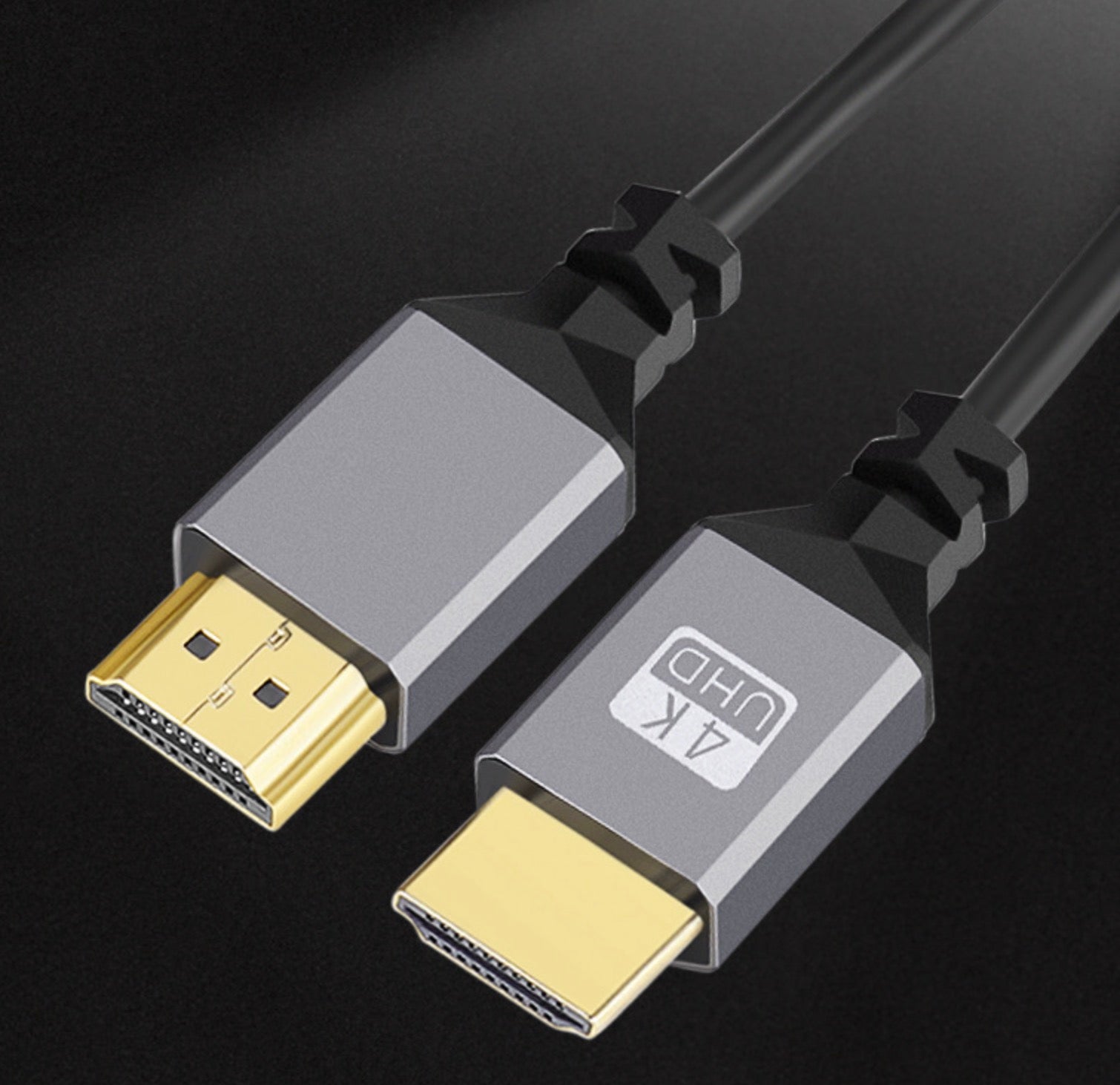 Close-up of HDMI 2.0 gold-plated connectors on coiled cable