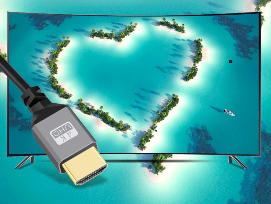 HDMI 2.0 coiled cable connected to a television displaying Ultra HD content