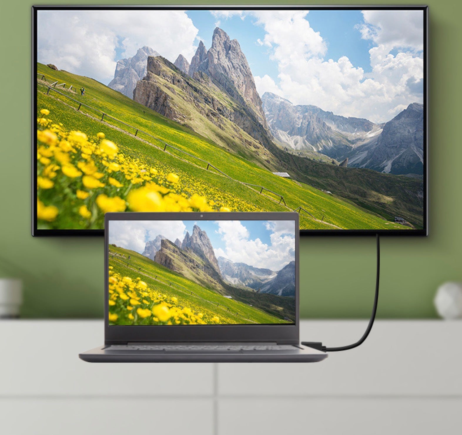 Mini HDMI to HDMI adapter cable connected to a television and monitor